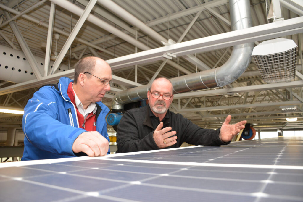 Wayne Scott from Loblaw discusses the makeup of the rooftop solar array with Vern Sherwood from Westhill Innovation