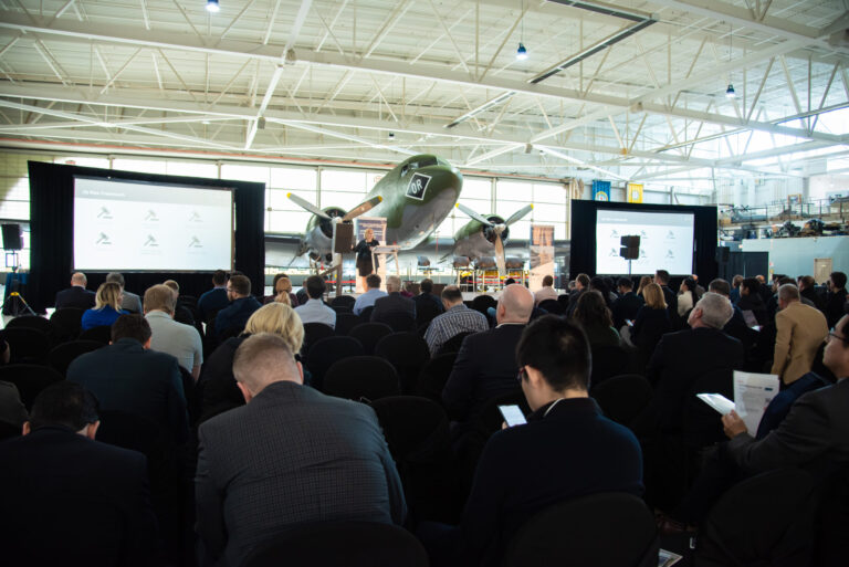 Attendees listening to a panel at the second annual Future of Transportation and Mobility Series event held at the Canadian Warplane Heritage Museum in Mount Hope Ontario.