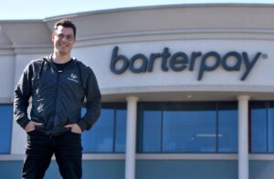 John Porter, CEO of BarterPay standing outside of their office.