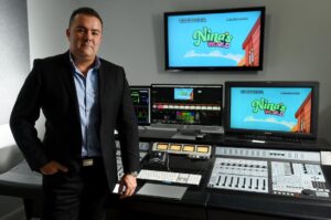 Pipeline Studios president Luis Lopez standing in front of a mixing table