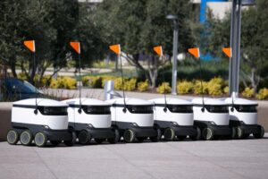Electric-powered robot delivery devices made by Starship Technologies on a street