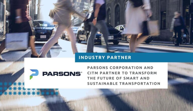 Parsons Corporation partners with CITM Innovation Challenge program. Image of people walking briskly across a crosswalk at a busy road while traffic is stopped.