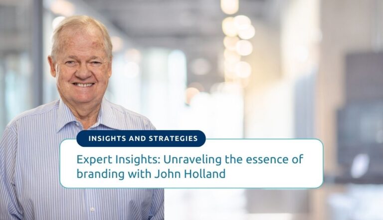 Text reads Expert Insights: Unraveling the essence of branding with John Holland. Background photo is Expert Advisor John Holland in Innovation Factory's Hamilton office.