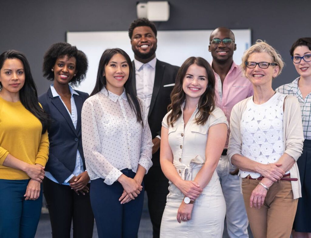 A diverse and inclusive group of entrepreneurs standing in an office space. Tap into inclusive resources and opportunities built by the groups they serve, fostering equity for every entrepreneur.