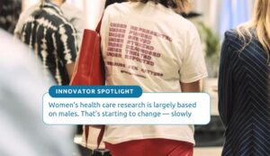 An audience member wears a T-shirt with statistics about gender-based inequity in healthcare, designed by Rachel Bartholomew of Femtech Canada, during the MaRS Impact Health conference on June 13, 2024.